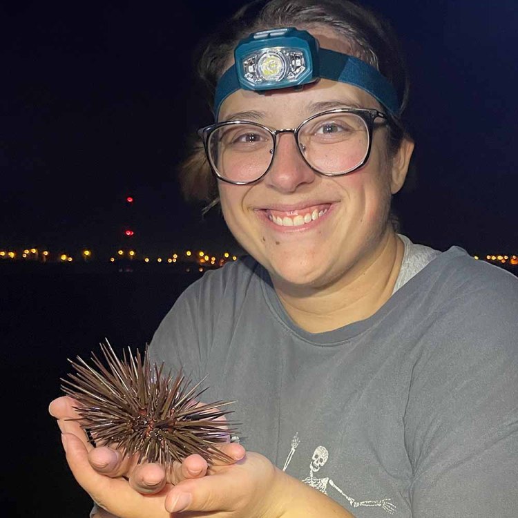 Emily Kornblum holding a sea urchin